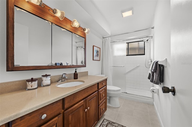 bathroom with tile patterned flooring, vanity, toilet, and a shower with door