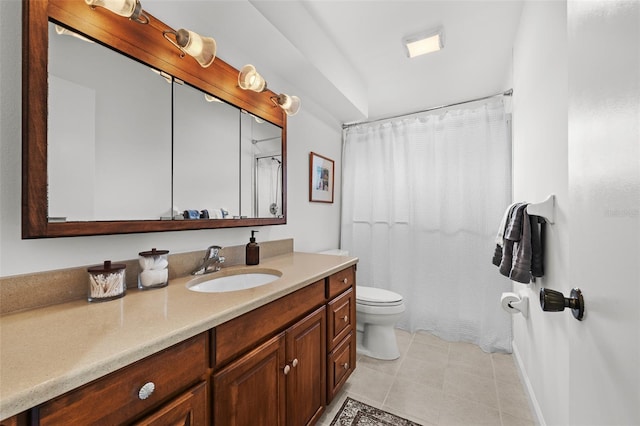 bathroom with tile patterned floors, vanity, and toilet