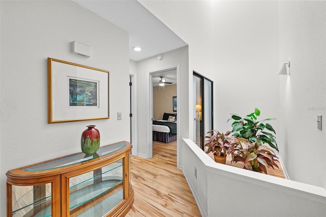 hall with light hardwood / wood-style floors