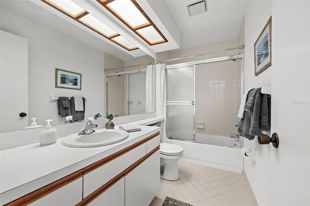 full bathroom featuring tile patterned flooring, vanity, shower / bath combination with curtain, and toilet