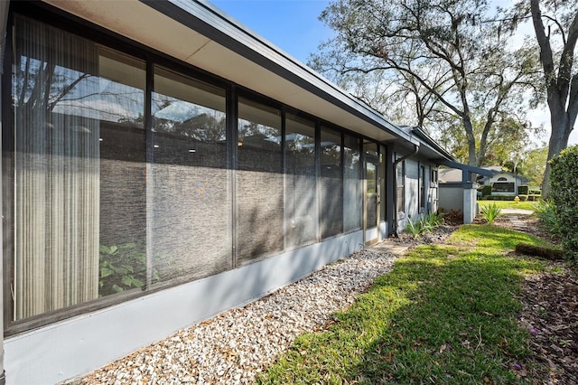 view of side of property with a sunroom