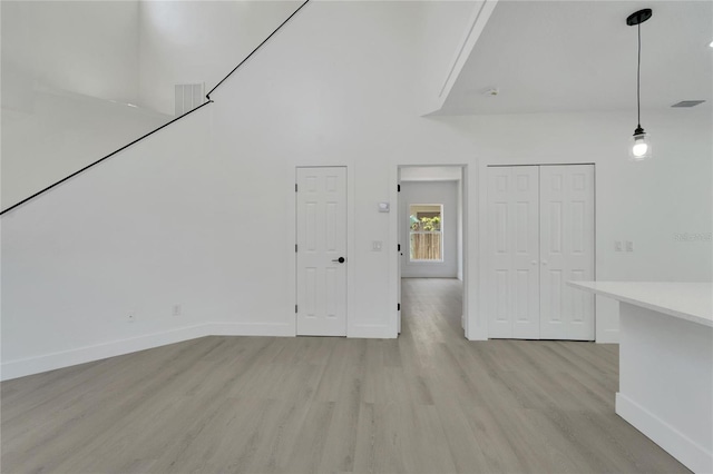 unfurnished living room featuring light hardwood / wood-style floors