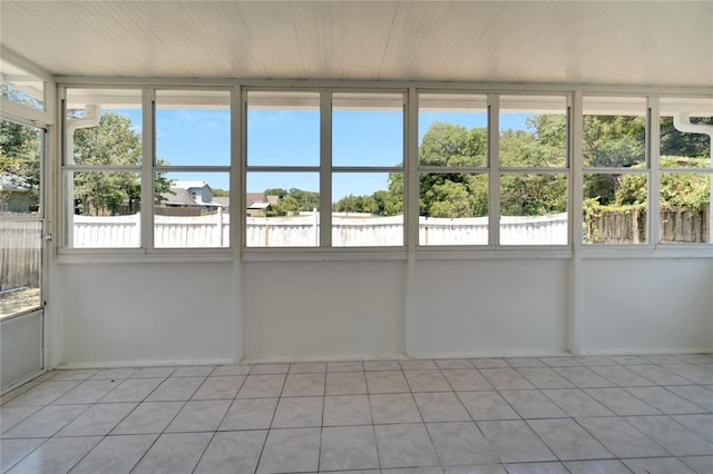 unfurnished sunroom featuring a wealth of natural light