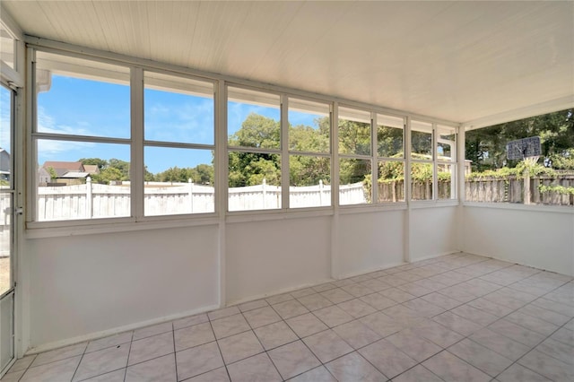 unfurnished sunroom with plenty of natural light