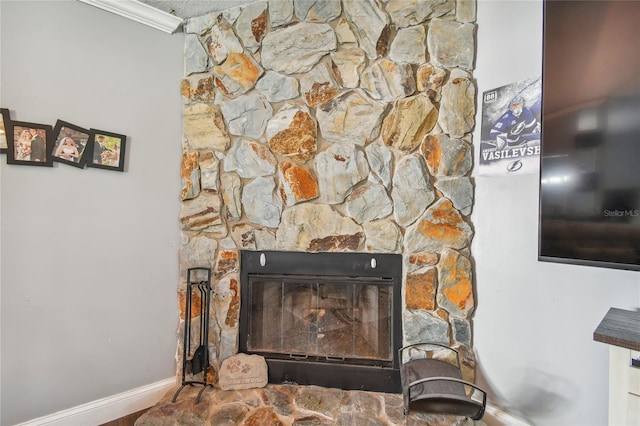 room details featuring a fireplace and ornamental molding