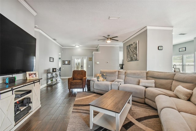 living room with ceiling fan, french doors, a textured ceiling, and ornamental molding