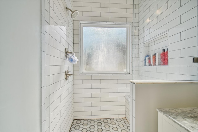 bathroom with tiled shower