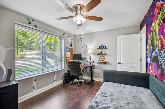 home office with a textured ceiling, ceiling fan, and dark hardwood / wood-style floors