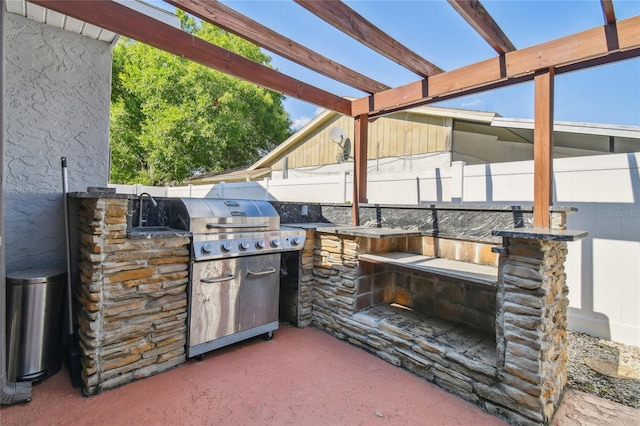 view of patio featuring a pergola, area for grilling, and a grill