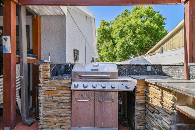 view of patio featuring area for grilling and an outdoor kitchen