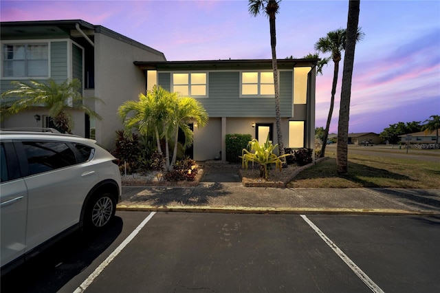 1028 Apollo Beach Blvd Unit 27, Apollo Beach, FL 33572 - townhome / multi-family property with stucco siding and uncovered parking