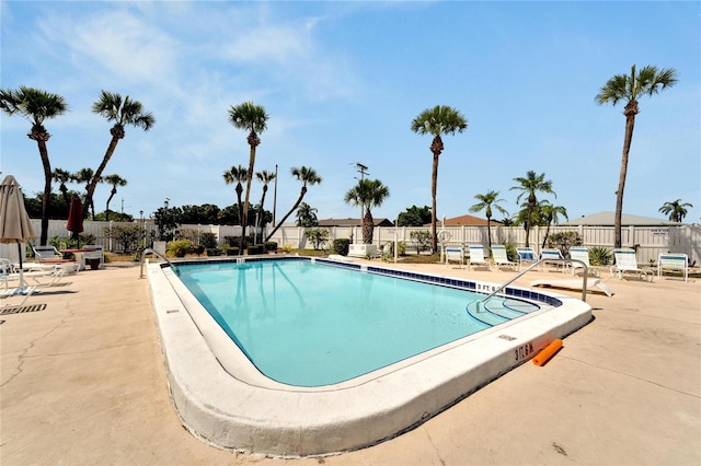 view of swimming pool with a patio