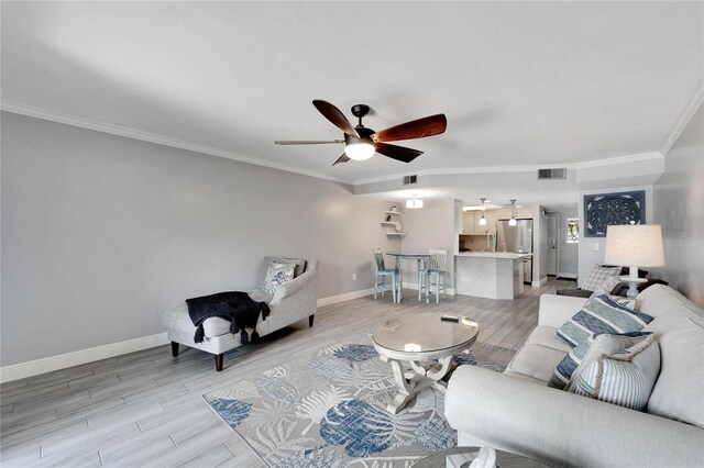 1028 Apollo Beach Blvd Unit 27, Apollo Beach, FL 33572 - living area with a ceiling fan, light wood-style floors, and crown molding