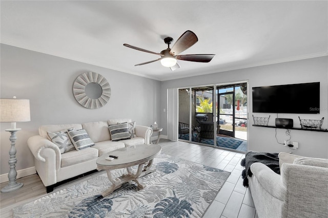 living room featuring light wood-type flooring, ceiling fan, and ornamental molding