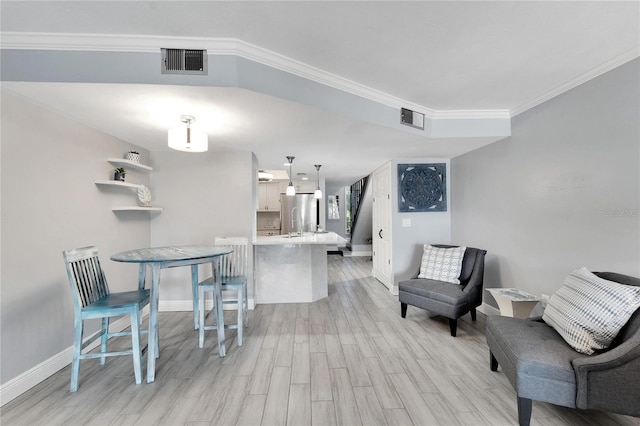 interior space featuring crown molding and light wood-type flooring