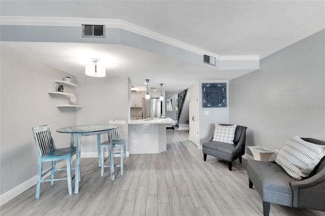 1028 Apollo Beach Blvd Unit 27, Apollo Beach, FL 33572 - living room with light wood-type flooring and crown molding