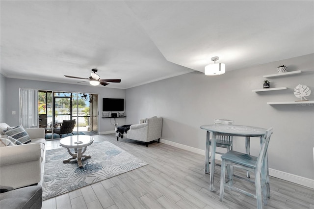 living room with ceiling fan, light hardwood / wood-style flooring, and ornamental molding