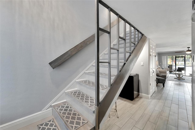 1028 Apollo Beach Blvd Unit 27, Apollo Beach, FL 33572 - staircase featuring ceiling fan and wood finished floors