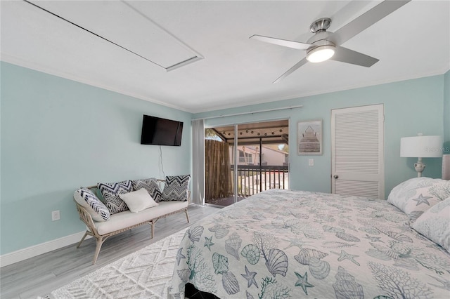 bedroom with access to outside, crown molding, ceiling fan, light wood-type flooring, and a closet