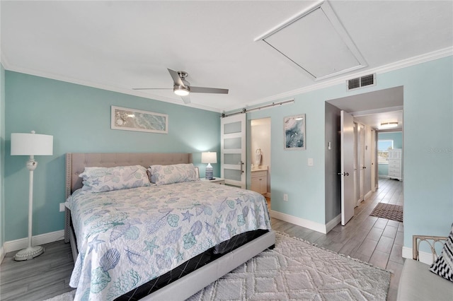 1028 Apollo Beach Blvd Unit 27, Apollo Beach, FL 33572 - bedroom featuring attic access, crown molding, wood finished floors, ceiling fan, and ensuite bathroom