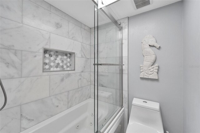 1028 Apollo Beach Blvd Unit 27, Apollo Beach, FL 33572 - bathroom with a combined bath / shower with jetted tub and toilet