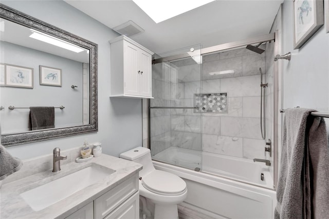 full bathroom with vanity, toilet, and combined bath / shower with glass door