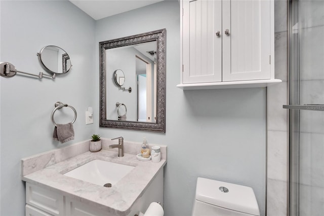 bathroom with vanity and toilet