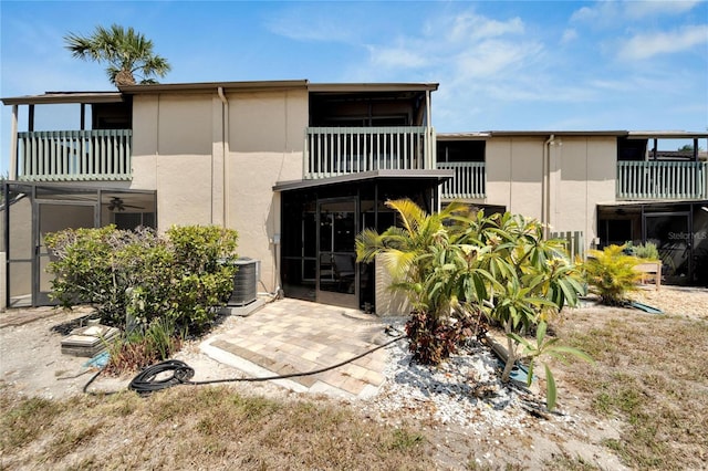 1028 Apollo Beach Blvd Unit 27, Apollo Beach, FL 33572 - back of house featuring a balcony and stucco siding
