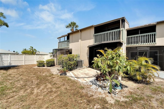 1028 Apollo Beach Blvd Unit 27, Apollo Beach, FL 33572 - rear view of property featuring stucco siding and a balcony