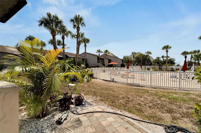 view of yard with a patio area and a community pool