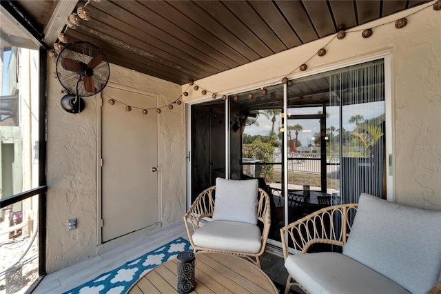 sunroom / solarium featuring wood ceiling