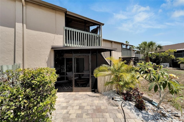 1028 Apollo Beach Blvd Unit 27, Apollo Beach, FL 33572 - back of property featuring a balcony and stucco siding