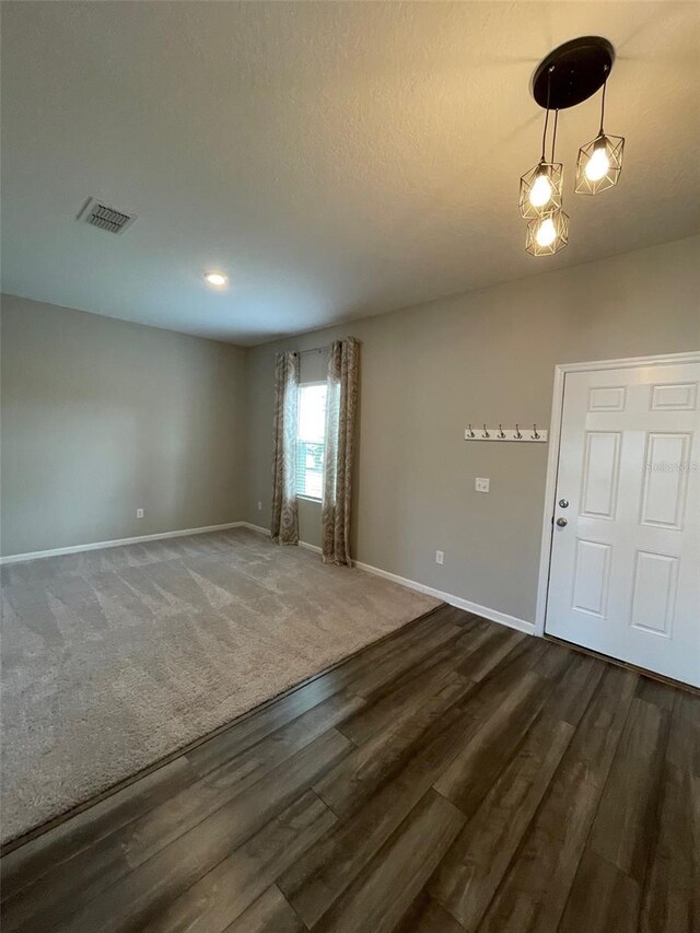 unfurnished room featuring dark hardwood / wood-style floors