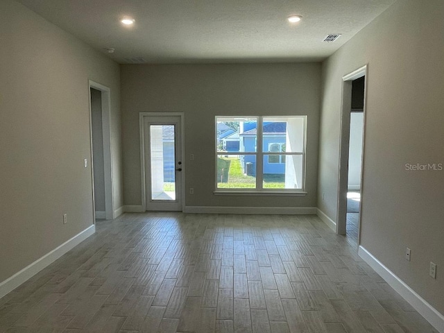 unfurnished room featuring hardwood / wood-style floors