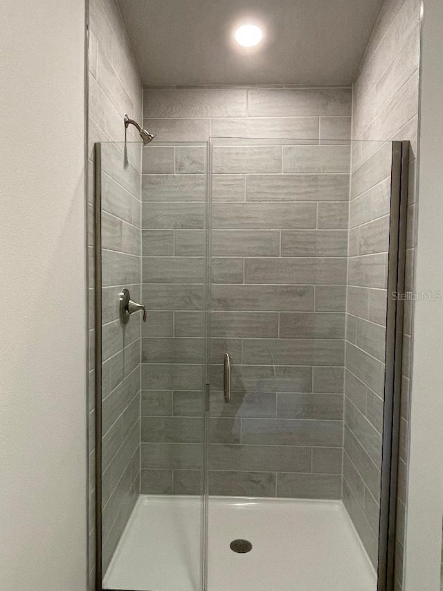 bathroom featuring walk in shower