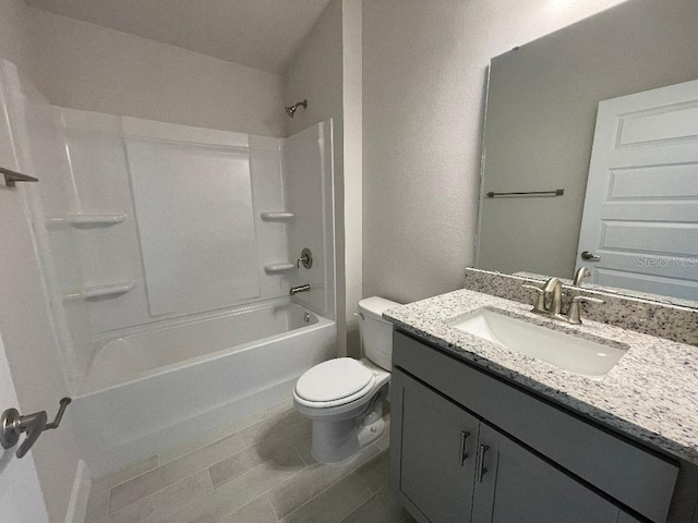 full bathroom featuring bathing tub / shower combination, tile patterned flooring, vanity, and toilet