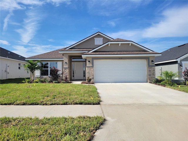 view of front of home featuring a garage and a front lawn