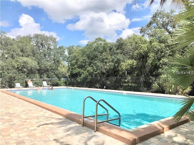 view of swimming pool featuring a patio