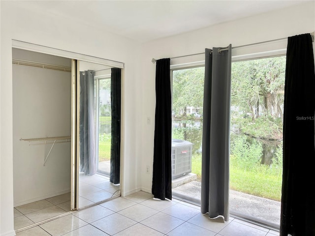 entryway with light tile patterned floors