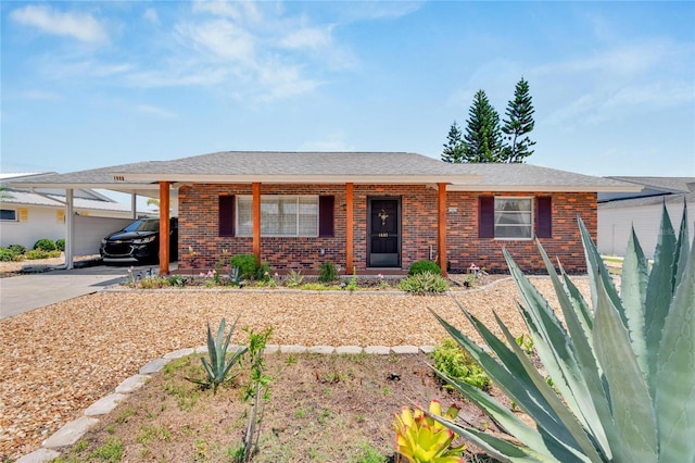 single story home featuring a carport