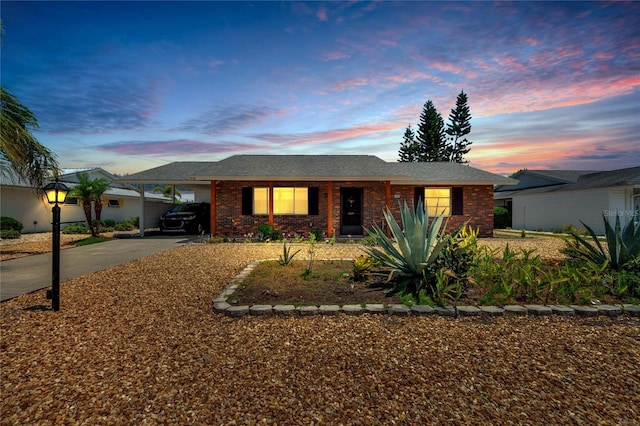 ranch-style home featuring a carport