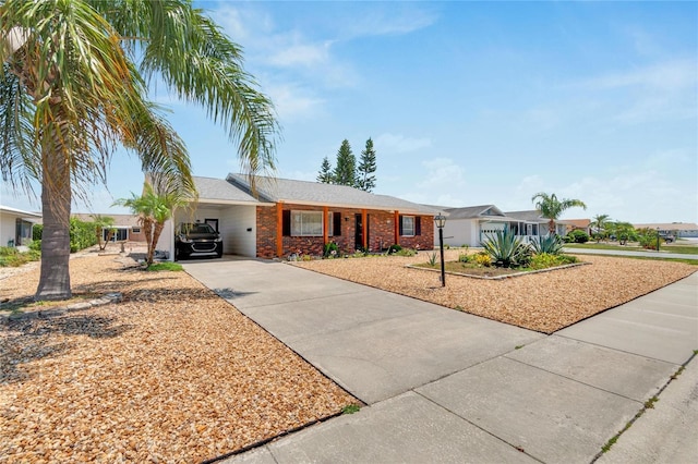 ranch-style house featuring a carport