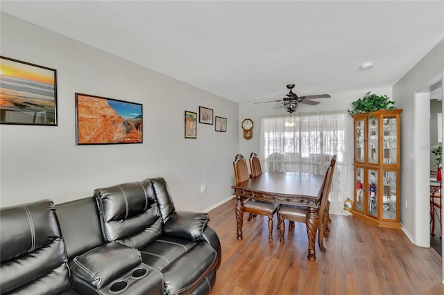 dining space featuring ceiling fan and wood-type flooring