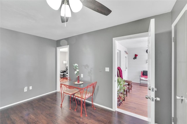 dining space featuring dark hardwood / wood-style floors and ceiling fan