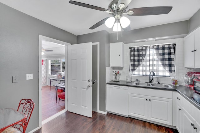 kitchen with white dishwasher, sink, dark hardwood / wood-style floors, and ceiling fan