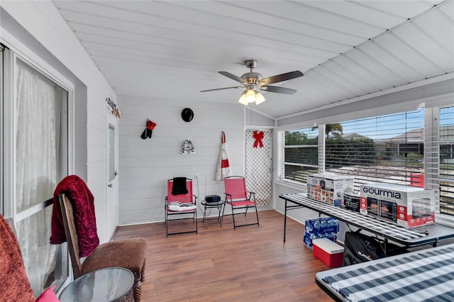 sitting room featuring ceiling fan, hardwood / wood-style flooring, and lofted ceiling