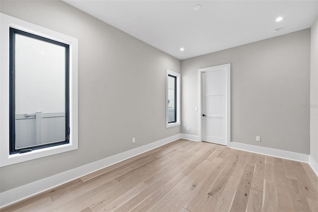 spare room featuring light hardwood / wood-style flooring