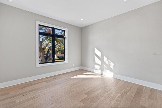 spare room with light wood-type flooring