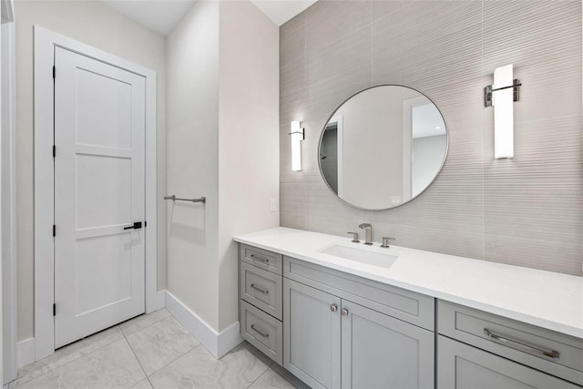 bathroom featuring tile walls and vanity