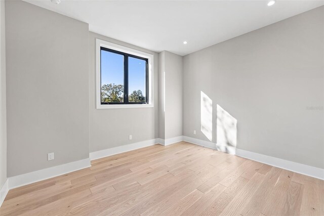 spare room featuring light wood-type flooring